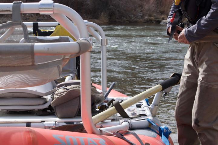 a person riding on the back of a boat