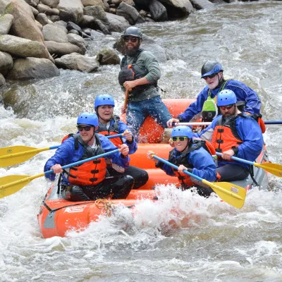 a group of people on a raft in the water