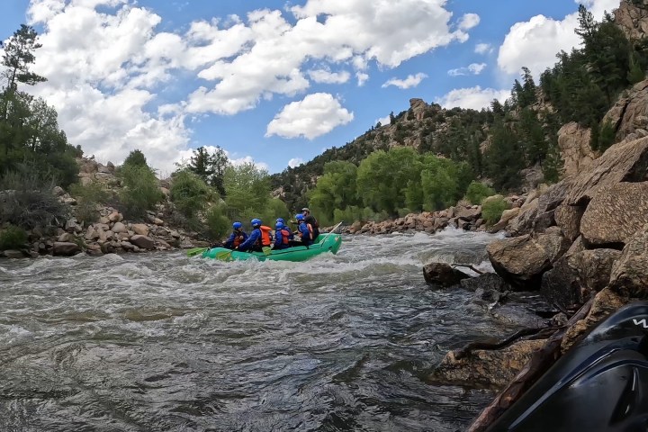 a group of people on a rocky beach